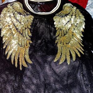 Black and gold wing shirt. See through material